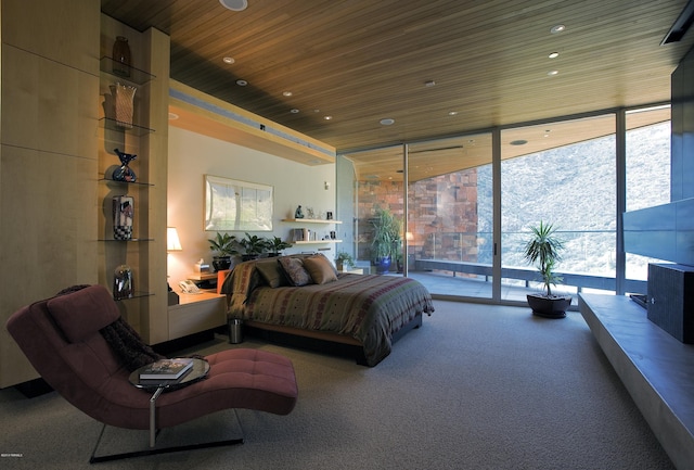 carpeted bedroom with wooden ceiling, multiple windows, floor to ceiling windows, and access to exterior