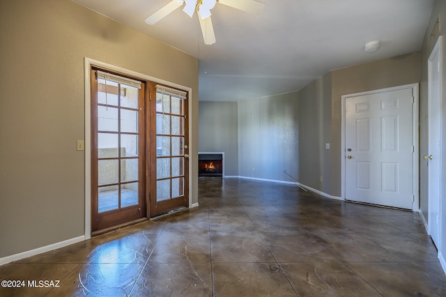 unfurnished room featuring ceiling fan