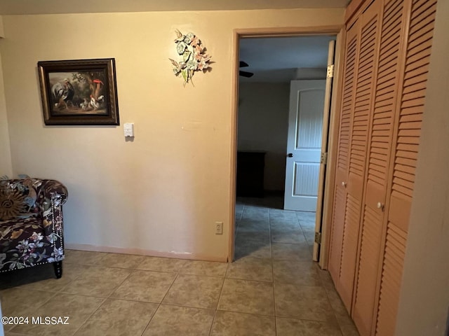 hall featuring light tile patterned flooring