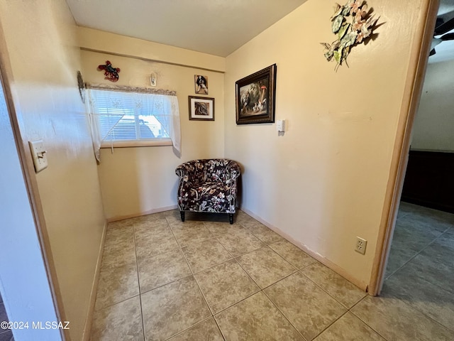 unfurnished room with light tile patterned floors