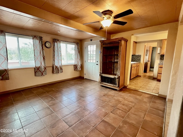 interior space featuring ceiling fan