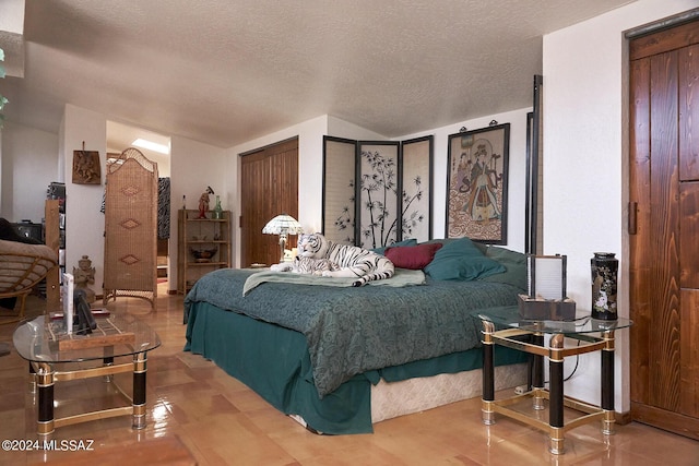 bedroom with a textured ceiling