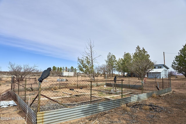 view of yard with a rural view