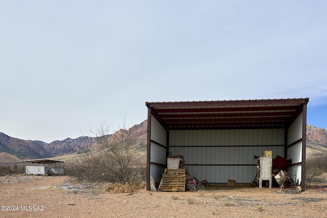 view of outbuilding with a mountain view