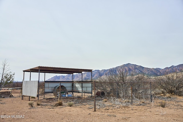 exterior space with a mountain view and an outdoor structure