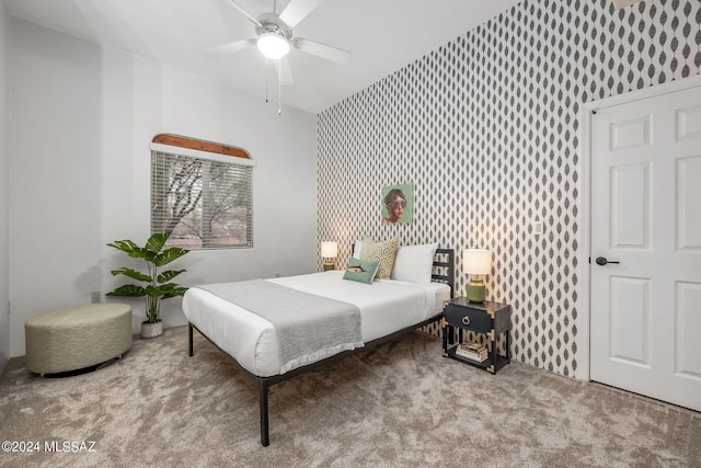 bedroom with ceiling fan and carpet