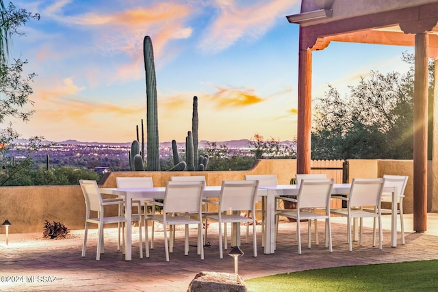 view of patio terrace at dusk