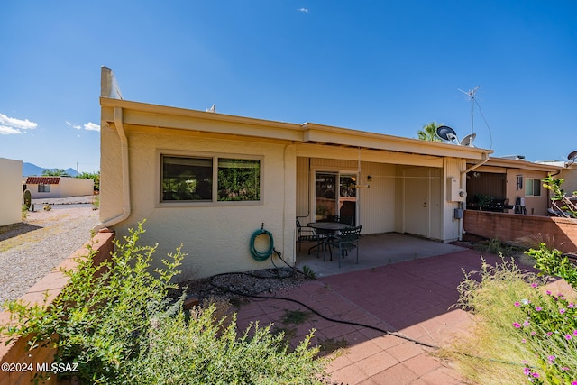 view of front of home with a patio