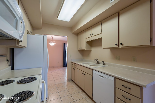 kitchen with white appliances, light tile patterned flooring, and sink