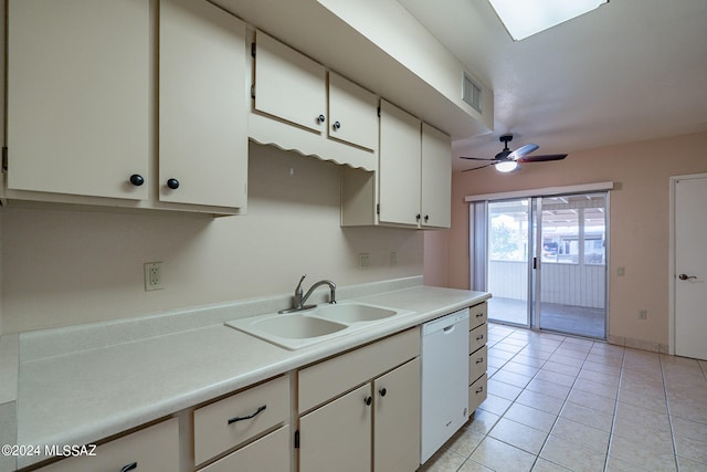 kitchen with dishwasher, sink, white cabinets, light tile patterned floors, and ceiling fan