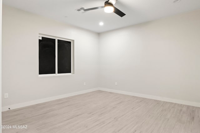 empty room featuring ceiling fan and light hardwood / wood-style floors