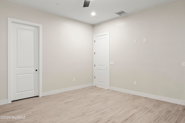 spare room featuring light hardwood / wood-style floors