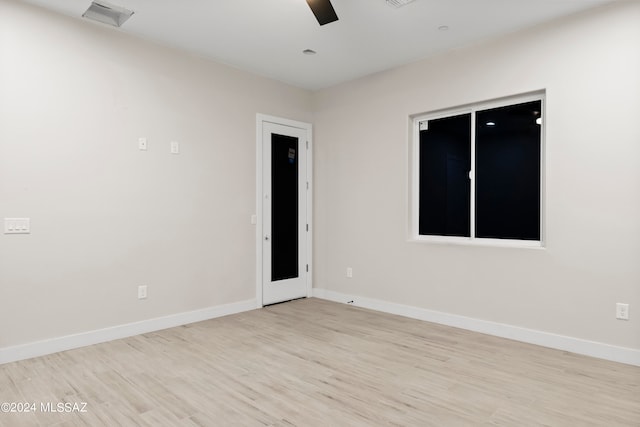 spare room featuring light wood-type flooring