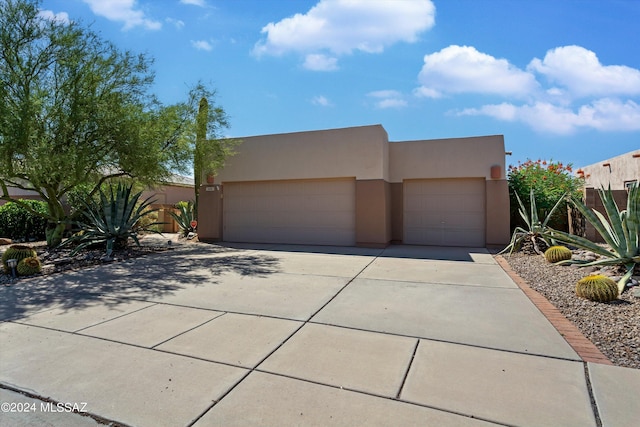 adobe home featuring a garage