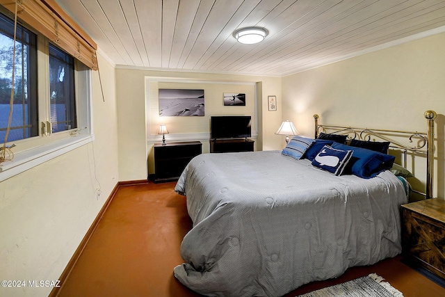 carpeted bedroom with wooden ceiling