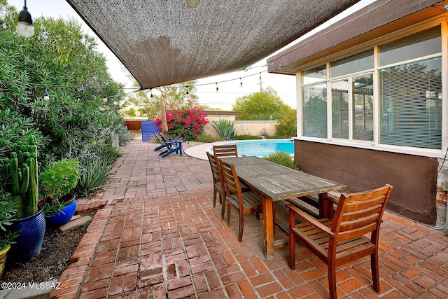 view of patio with a fenced in pool