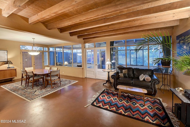 sunroom / solarium featuring beamed ceiling, a healthy amount of sunlight, and wooden ceiling