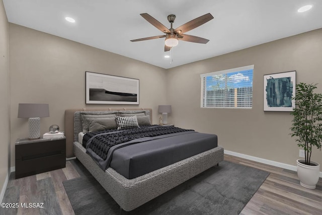 bedroom featuring hardwood / wood-style floors and ceiling fan