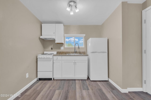 kitchen featuring white appliances, light hardwood / wood-style floors, sink, and white cabinets