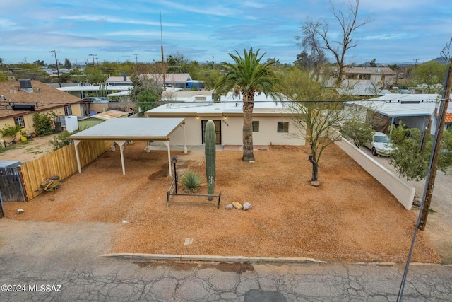 view of front facade with a carport