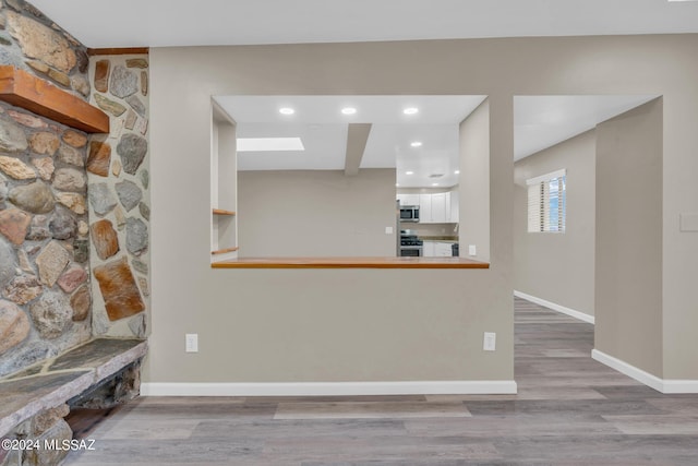 unfurnished living room with light wood-type flooring