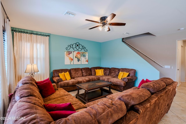 living room with ceiling fan and light tile patterned floors