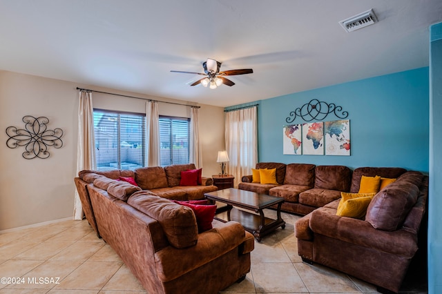 living room featuring ceiling fan and light tile patterned flooring