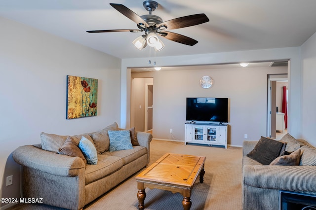 carpeted living room featuring ceiling fan