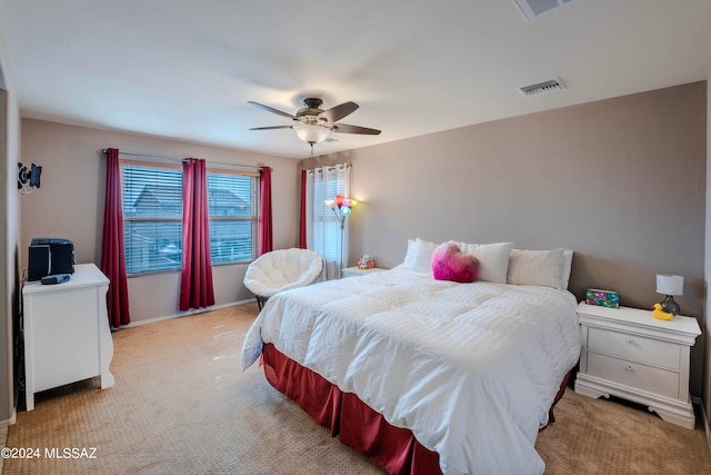 carpeted bedroom with ceiling fan