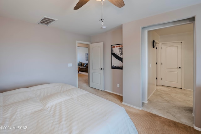 bedroom featuring ceiling fan and light colored carpet