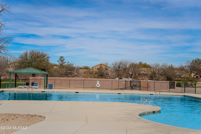 view of swimming pool with a gazebo and a patio