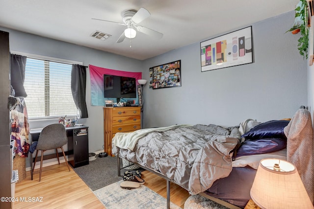 bedroom featuring ceiling fan and light hardwood / wood-style flooring