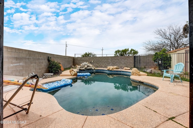 view of pool featuring a patio