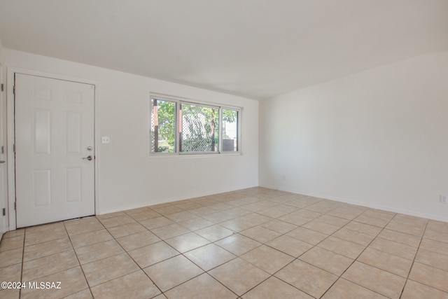 empty room with light tile floors