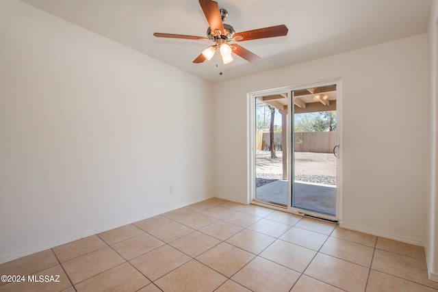 tiled empty room with ceiling fan