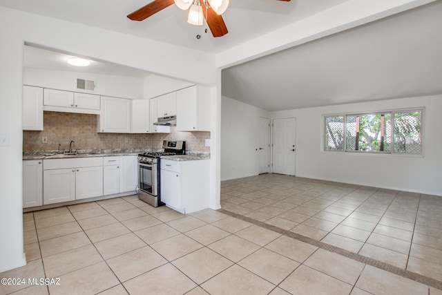 kitchen featuring gas stove, white cabinetry, ceiling fan, and light tile floors