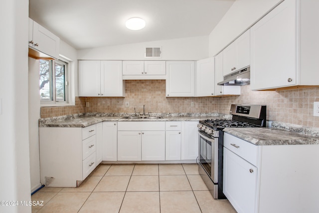 interior space with ceiling fan and light tile floors