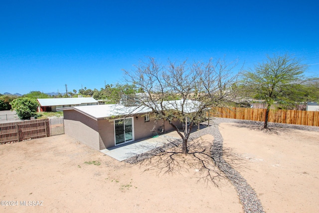 rear view of house with a patio area