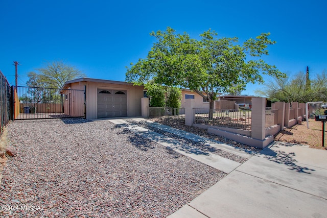 ranch-style home featuring a garage