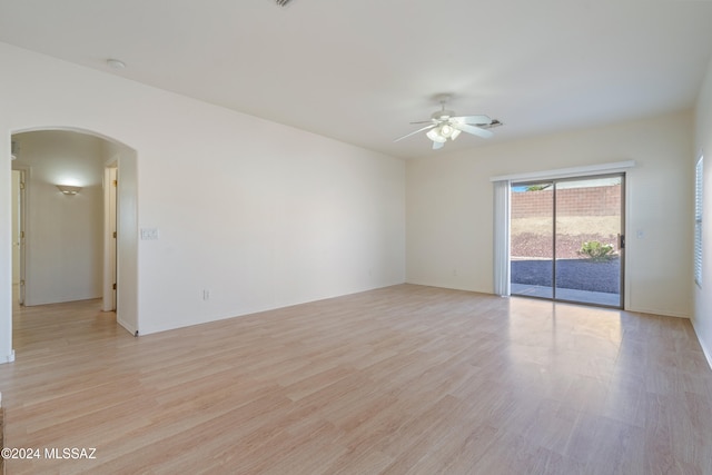 spare room featuring light hardwood / wood-style flooring and ceiling fan