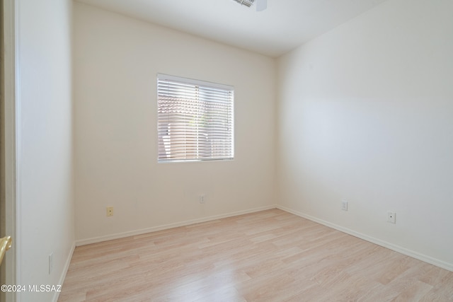 spare room featuring light wood-type flooring