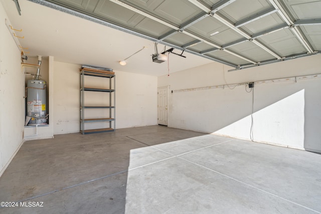 garage featuring gas water heater and a garage door opener