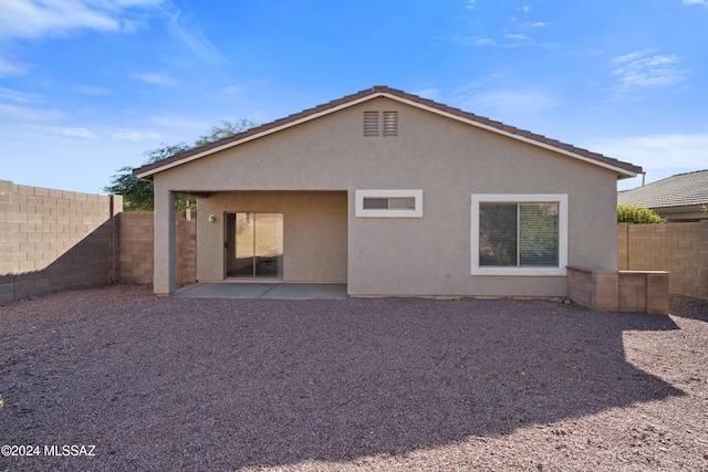 rear view of property with a patio