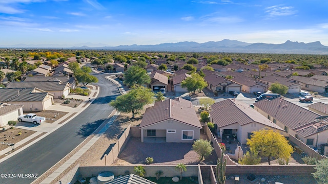 birds eye view of property featuring a mountain view