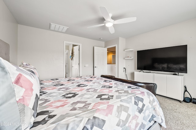 bedroom featuring ceiling fan and light carpet