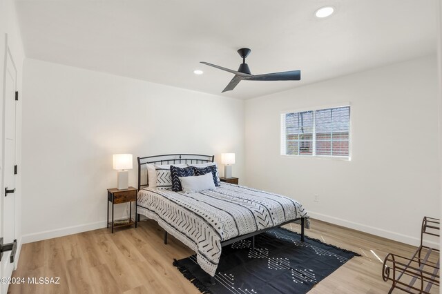 bedroom featuring ceiling fan and light wood-type flooring