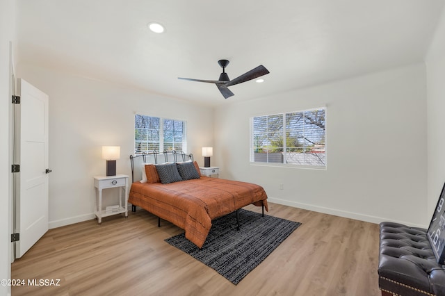 bedroom featuring ceiling fan and light wood-type flooring