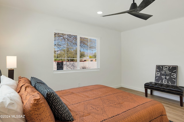 bedroom featuring ceiling fan and light hardwood / wood-style floors