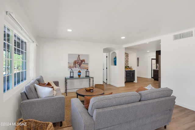 living room with light hardwood / wood-style flooring