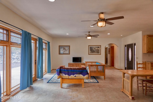 tiled bedroom featuring ceiling fan and access to outside